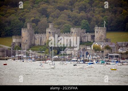 Conwy Castle fortification in Conwy, North Wales. seen from Deganwy across the `River Conwy into the quay area marina Stock Photo